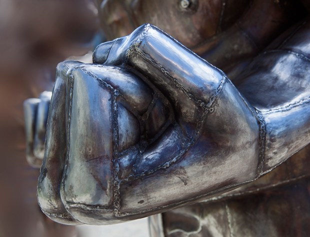 The glint of metal became a fist