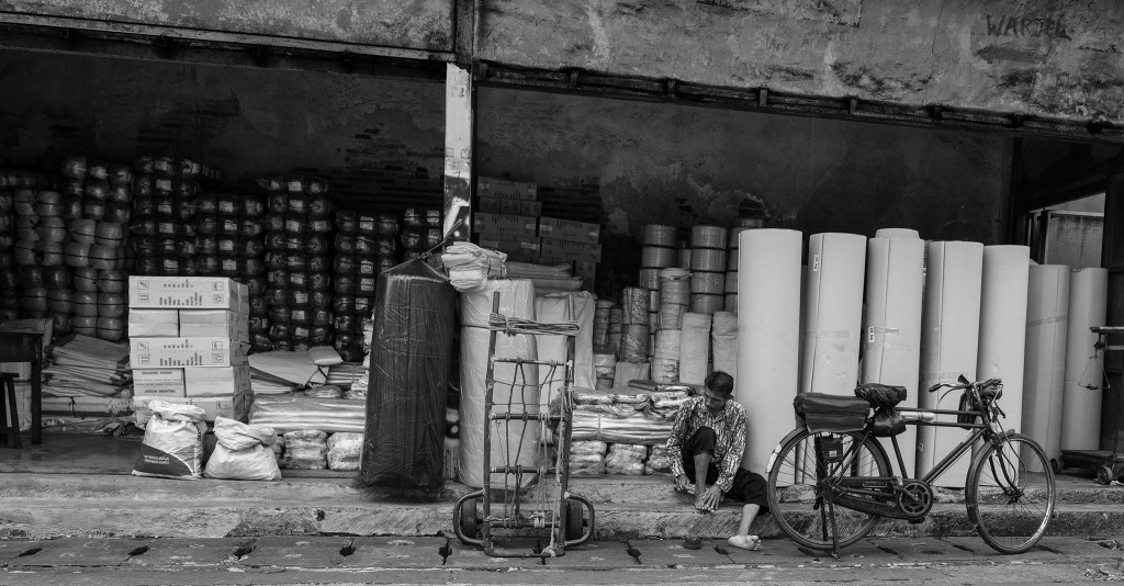 Bicyclist Taking a Break, Jakarta, Java, Indonesia