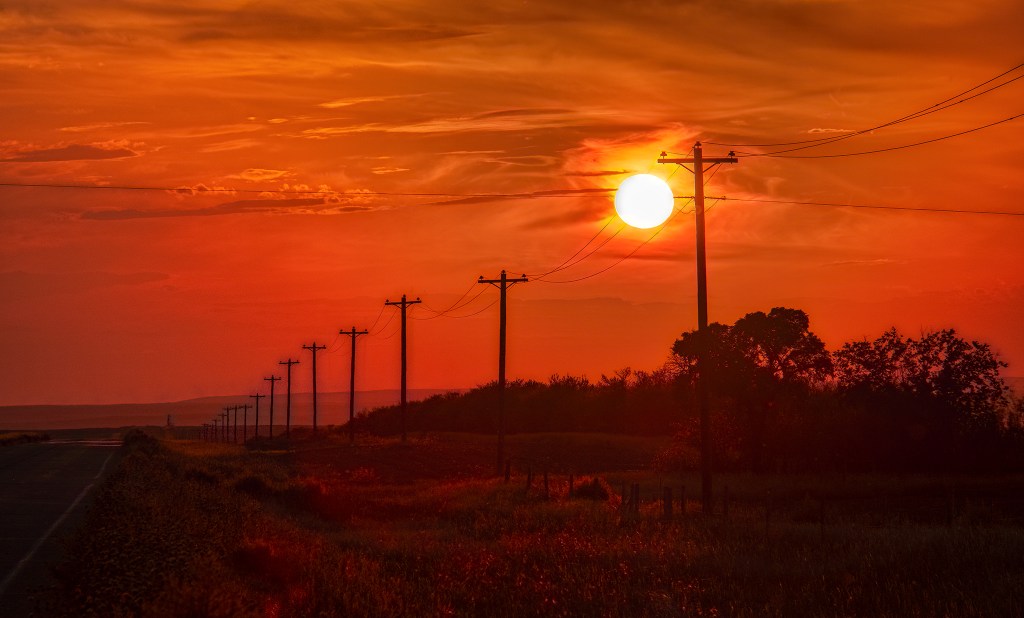 Orb in a Red Sky, Highway 555, Bindloss, Alberta, Canada