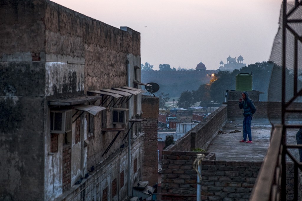 Contrasts at Dawn, Chandi Chowk and Red Fort (old Delhi), New Delhi, India